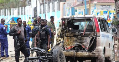 Security officers patrol on the site of a car-bomb attack in Mogadishu, on September 25, 2021. (AFP Photo)