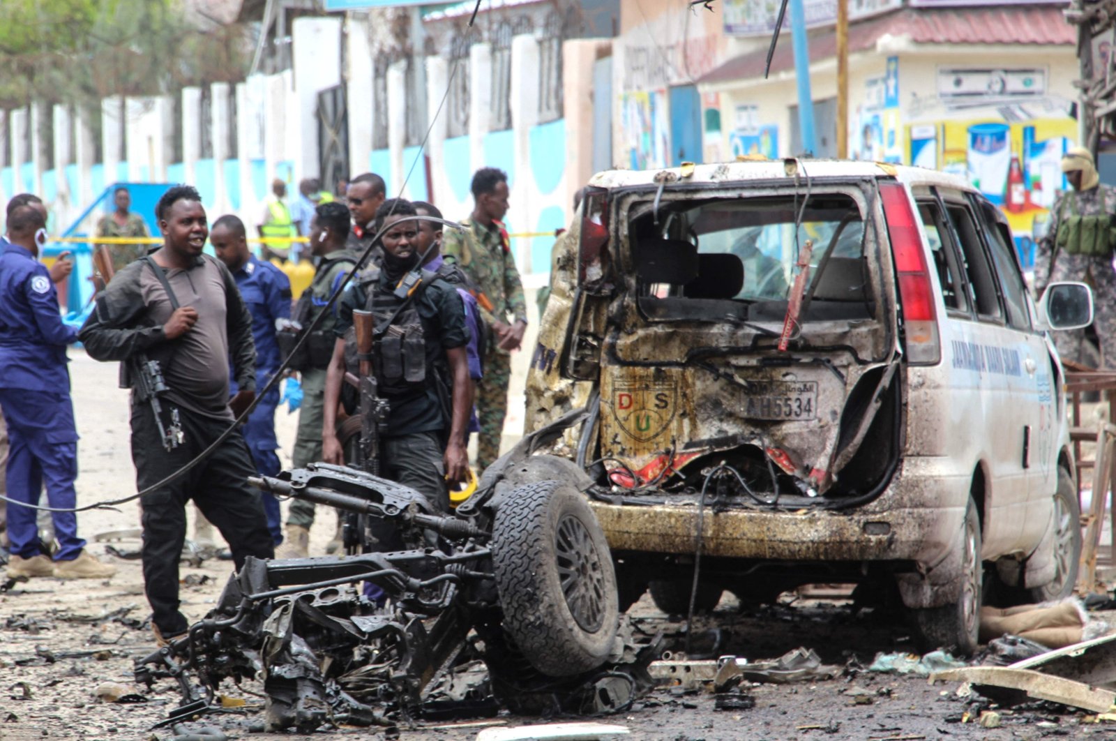 Security officers patrol on the site of a car-bomb attack in Mogadishu, on September 25, 2021. (AFP Photo)