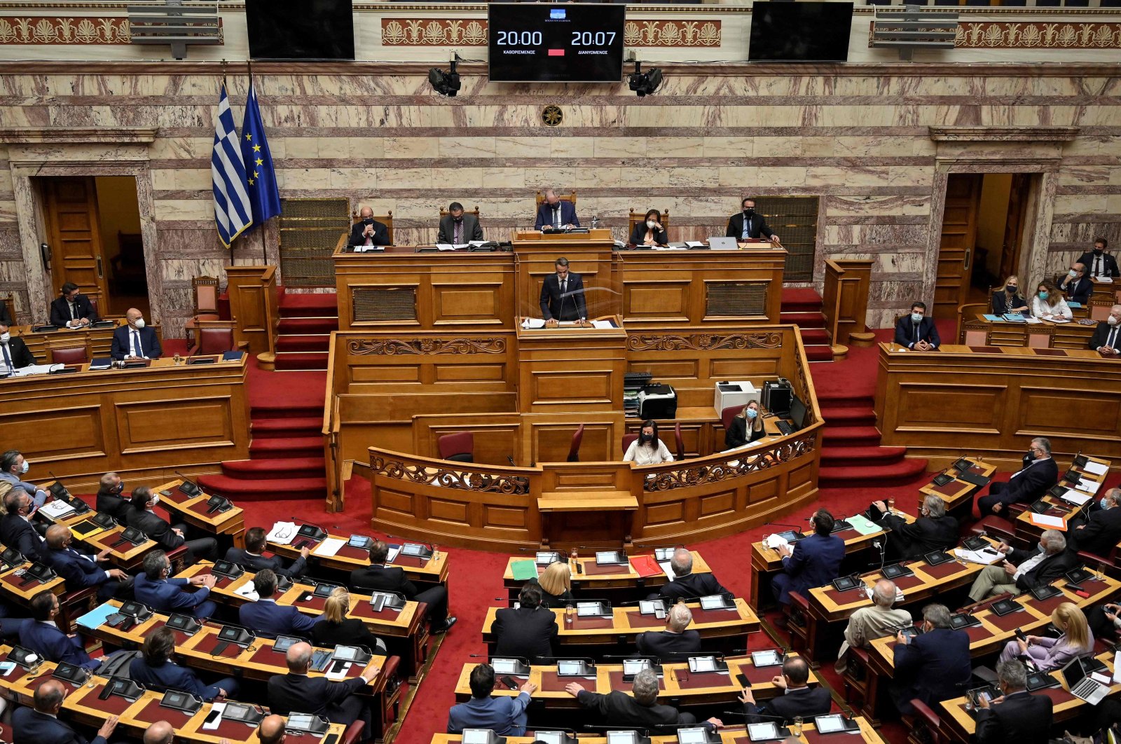 Greece's Prime Minister Kyriakos Mitsotakis (C) addresses the Greek Parliament during a session to ratify a defense deal with France, in Athens, Greece, Oct. 7, 2021. (AFP Photo)