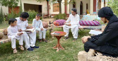 Muhammad Omar Orakzai (C) speaks to his students during a lesson, in Kohat, Pakistan, Oct. 7, 2021. (AA PHOTO) 