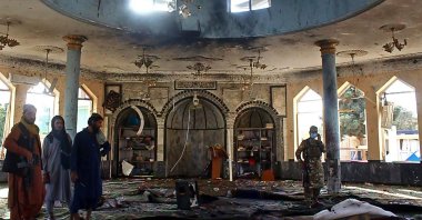Taliban fighters investigate inside a Shiite mosque after a suicide bomb attack in Kunduz, Oct. 8, 2021. (AFP Photo)