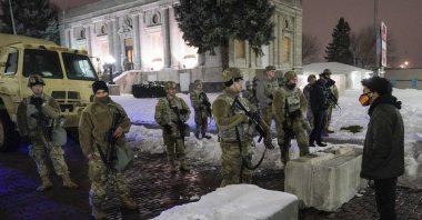 A protester confronts National Guard members outside a museum, in Kenosha, Wis., U.S, Jan. 5, 2021. (AP File Photo)