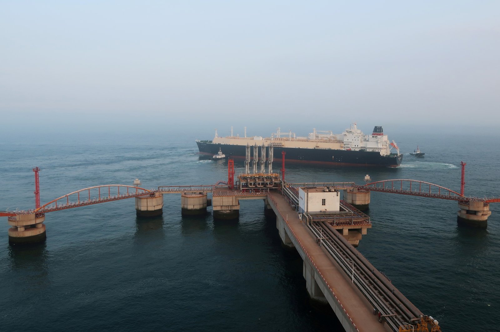 A liquified natural gas (LNG) tanker leaves the dock after discharge at PetroChina's receiving terminal in Dalian, Liaoning province, China, July 16, 2018.  (Reuters Photo)