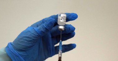 A medical worker prepares a shot of Pfizer COVID-19 vaccine, at Belgrade Fair makeshift center in Belgrade, Serbia, Oct. 2, 2021. (AP Photo)