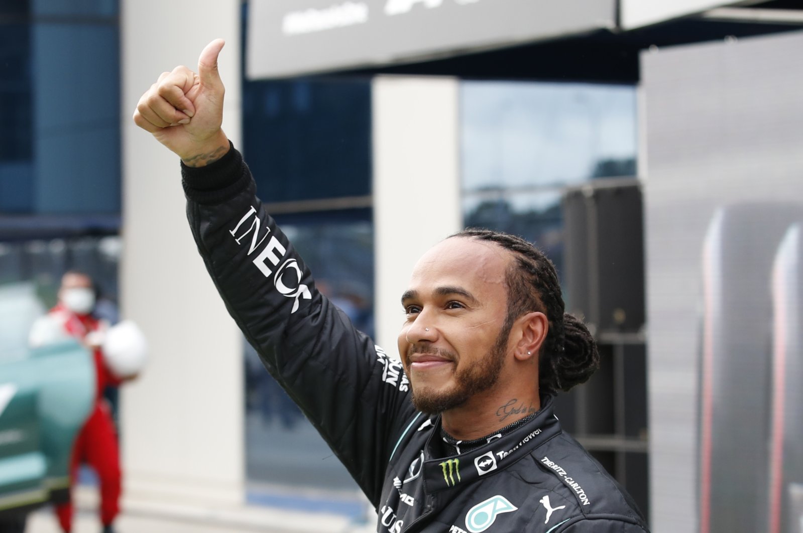 Mercedes driver Lewis Hamilton of Britain, reacts to the crowds after the end of qualifying for Sunday's Formula One Turkish Grand Prix at the Intercity Istanbul Park circuit in Istanbul, Turkey, Saturday, Oct. 9, 2021. (AP Photo)