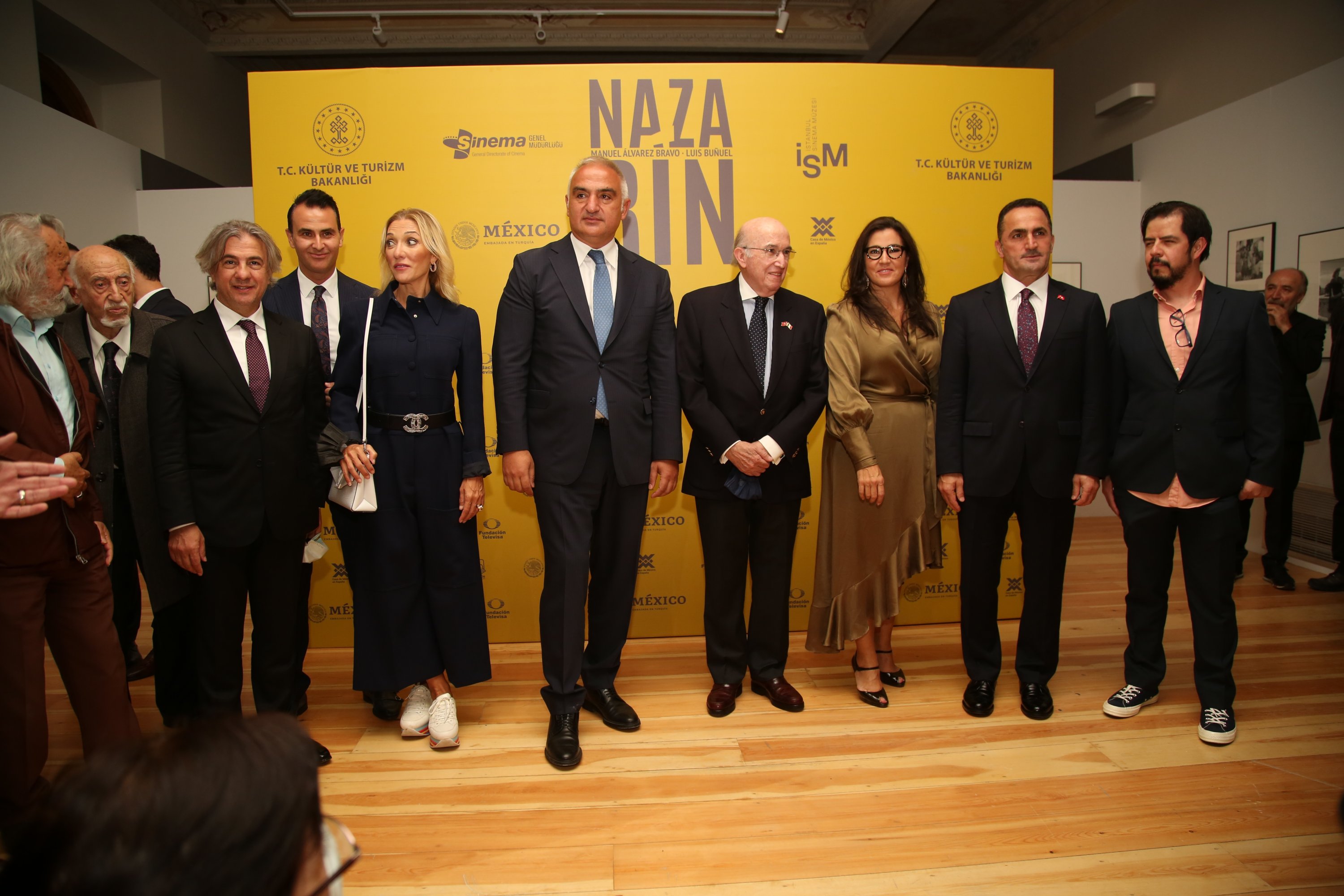 Minister of Culture and Tourism Mehmet Nuri Ersoy (C-L) and the Mexican Ambassador to Ankara Jose Luis Martinez y Hermandez (C-R) among others pose during the "Nazarin" exhibition at the Istanbul Cinema Museum, in Istanbul, Turkey, Oct. 8, 2021.