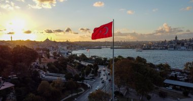 A Turkish flag by the Bosporus at the evening sunset in Istanbul, Turkey, Oct. 4, 2021. (Photo by Getty Images)