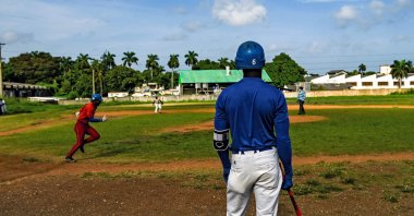 Baseball players play with friends at a field in Havana, Cuba, Oct. 7, 2021. (AFP PHOTO) 