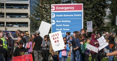 Protesters gather at the Foothills Hospital to oppose COVID-19-related public health measures in Calgary, Alberta, Canada, Sept. 13, 2021. (AP File Photo)