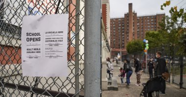 Students arrive for in-person classes outside the Public School 188 The Island School, in the Manhattan borough of New York, U.S., Sept. 29, 2020. (AP Photo)