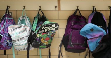 Colorful backpacks hang on a coat rack at Lincoln Elementary School, in Appleton, Wisconsin, U.S., Feb. 4, 2020. (Reuters File Photo)