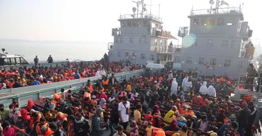 Rohingya refugees wait on naval ships to be transported to an isolated island in the Bay of Bengal, in Chittagong, Bangladesh, Dec. 29, 2020. (AP Photo)