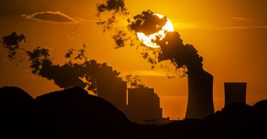 The sun sets behind a coal-fired power station Boxberg and the open-face mine Reichwalde, in Hammerstadt, Germany, April 9, 2020. (Getty Images)
