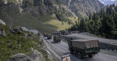 An Indian Army convoy moves on the Srinagar-Ladakh highway in Gagangeer, northeast of Srinagar, Indian-controlled Kashmir, Sept. 9, 2020. (AP Photo)