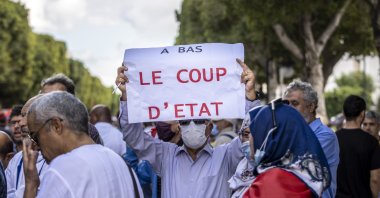 Tunisians face riot police during a rally against their president along the Habib Bourguiba avenue in the capital Tunis, Tunisia, Oct. 10, 2021. (AA Photo)