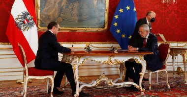 Austria's President Alexander Van der Bellen and new Chancellor of the People's Party (ÖVP) Alexander Schallenberg sign contracts during the swearing-in ceremony in Vienna, Austria, Oct. 11, 2021. (Reuters Photo)
