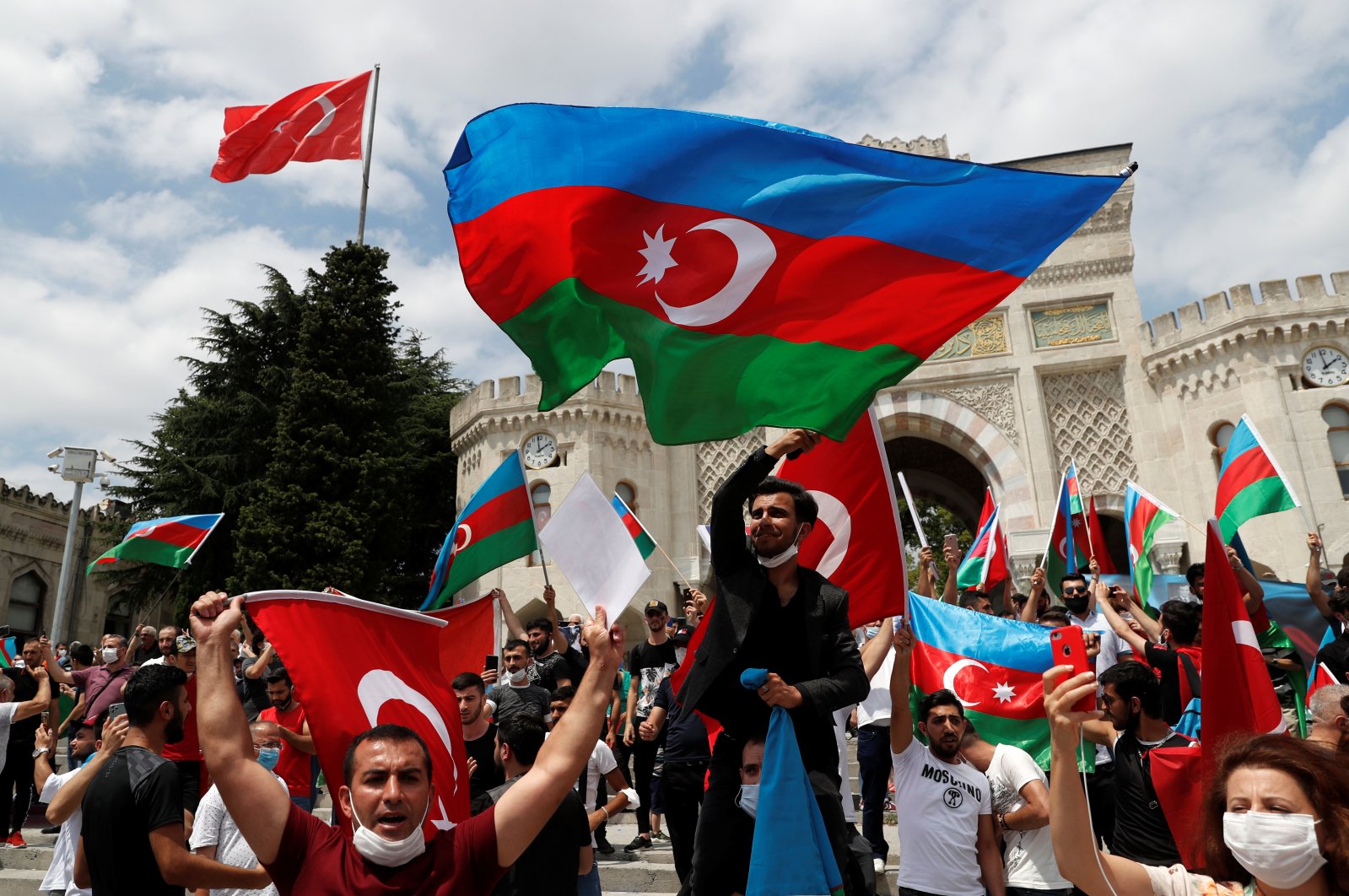 Azerbaijani men living in Turkey wave flags of Turkey and Azerbaijan during a protest following clashes between Azerbaijan and Armenia, in Istanbul, Turkey, July 19, 2020. (Reuters File Photo)