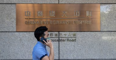 A man walks past the China Evergrande Centre in Hong Kong, China, Oct. 4, 2021. (EPA Photo)