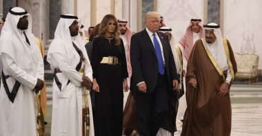 Former U.S. President Donald Trump and first lady Melania Trump walk with Saudi King Salman to a coffee ceremony and presentation ceremony of the Collar of Abdulaziz Al Saud Medal at the Royal Court Palace in Riyadh, Saudi Arabia, May 20, 2017. (AP Photo)