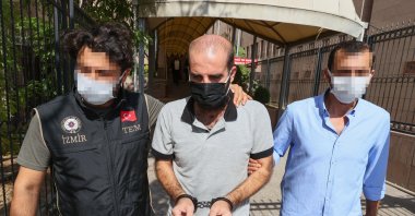 Police escort PKK terrorist Delil Hıso in Izmir, Turkey, Oct. 11, 2021. (AA Photo)