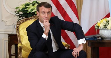 France's President Emmanuel Macron reacts as he talks with U.S. President Donald Trump during their meeting at Winfield House, London, U.K., Dec. 3, 2019. (AFP Photo)