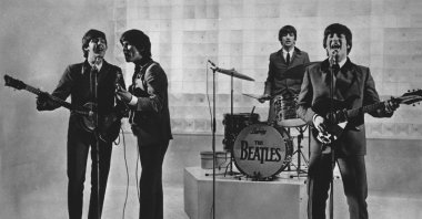 The Beatles, from left to right, Paul McCartney, George Harrison, Ringo Starr and John Lennon, are seen performing. (AP Photo)