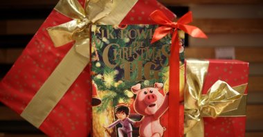 A copy of "The Christmas Pig," a children's book written by J. K. Rowling, is displayed at a Waterstones store in London, England, Oct. 12, 2021. (REUTERS Photo)