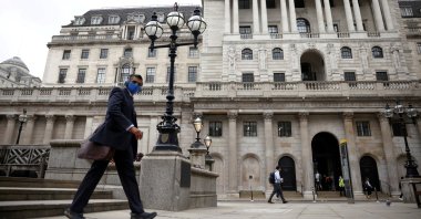 A person walks past the Bank of England in the City of London financial district, in London, Britain, June 11, 2021. (REUTERS/Henry Nicholls/File Photo)
