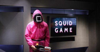 Participants take part in an event where they play the games of Netflix smash hit "Squid Game" at the Korean Cultural Centre in Abu Dhabi, on Oct. 12, 2021.  (AFP Photo)