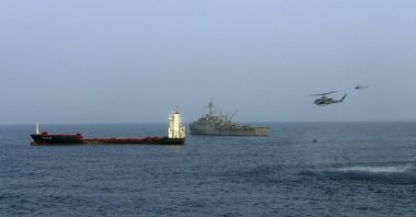 USS Dubuque (C) shadows the Antigua-Barbuda-flagged German-owned vessel M/V Magellan Star off the coast of Somalia, Sept. 9, 2010. (EPA-EFE Photo)