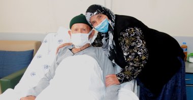 The 80-year-old Ali Öküzcü (L) who beat COVID-19 and cancer with the support of his wife Yeter Öküzcü, Adana, Turkey, Oct. 12, 2021. (DHA Photo)
