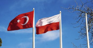 The flags of Turkey and Poland wave in the sky in Polonezköy, Istanbul, Turkey. (Photo by Shutterstock)