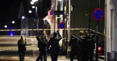 Police stand at the scene after an attack in Kongsberg, Norway, Oct. 13, 2021. (AP Photo)