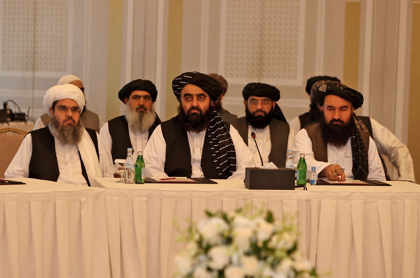 Members of the Taliban delegation Shahabuddin Delawar (L), Amir Khan Muttaqi, and Khairullah Khairkhwa (R) meet with foreign diplomats in Qatar's capital Doha, on Oct.12, 2021. (AFP Photo)