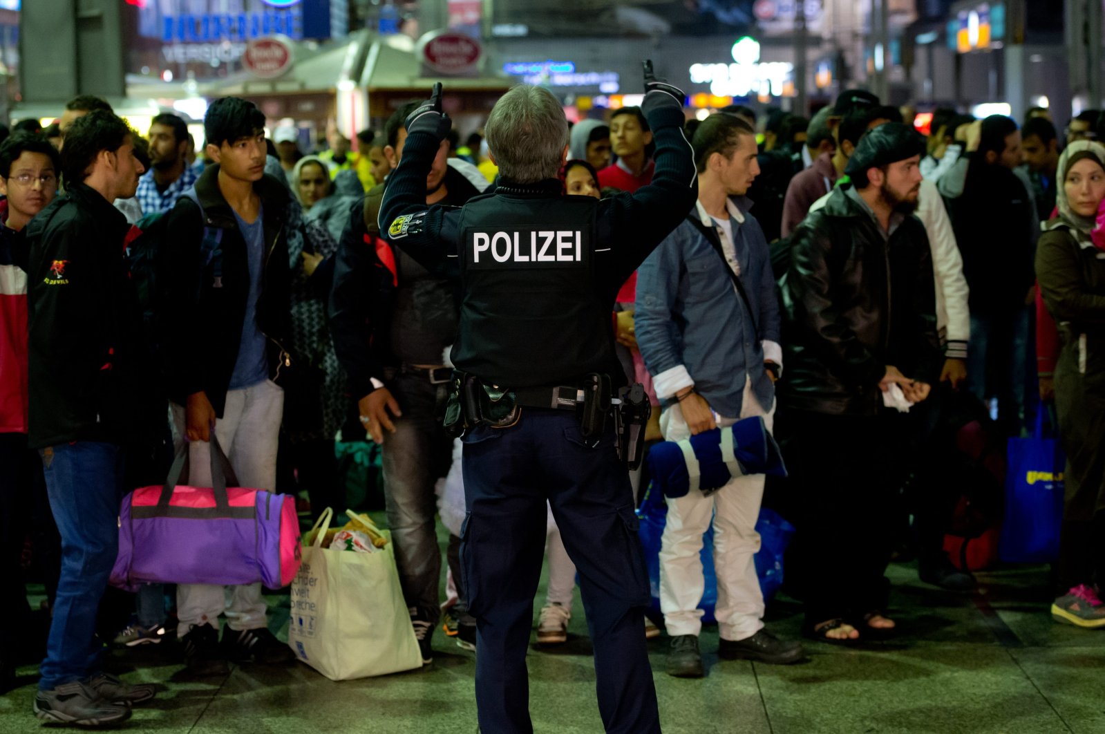 Refugees and migrants arrive at the central station in Munich, southern Germany, Sept. 13, 2015. (AP Photo)