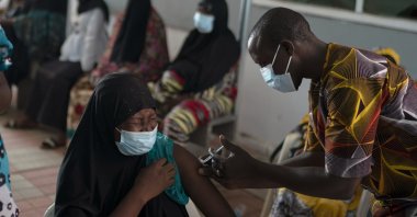 A health worker administers a dose of the Johnson & Johnson COVID-19 vaccine at the Bundung Maternal and Child Health Hospital in Serrekunda, outskirts of Banjul, Gambia, Sept. 23, 2021. (AP Photo)