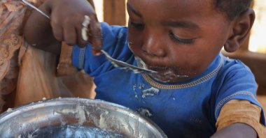 A Malagasy child eats a meal at the Avotse feeding program that benefits malnourished children with hot meals in Maropia Nord village in the region of Anosy, southern Madagascar, Sept. 30, 2021. (Reuters Photo)