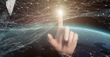 Computers, the internet, mobile phones, fiber cables and satellites weave together an ever-growing electronic, digital network where everything and everyone is interconnected today. (Shutterstock Photo) 