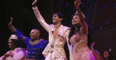 Michael James Scott (C-L) as Genie, Michael Maliakel (C) as Aladdin, and Shoba Narayan (R) as Jasmine after a performance of the Broadway musical "Aladdin" in New York, U.S., Sept. 28, 2021. (Disney Theatrical Productions via AP)