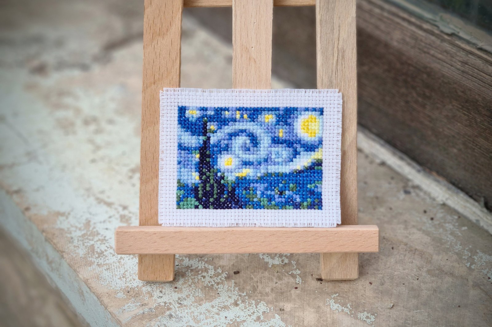 A recreation of "The Starry Night" from Elçin Özcan's mini-gallery comprising of cross-stitch versions of the world's most famous masterpieces. (DPA Photo)