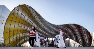 Visitors walk past the exterior of the Iraqi pavilion at the Expo 2020 in the Gulf Emirate of Dubai, on Oct. 13, 2021. (Photo by Karim SAHIB / AFP)