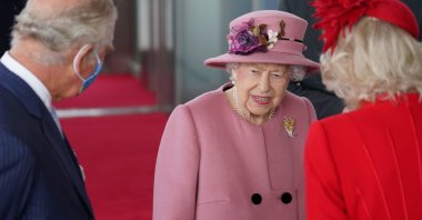 Britain's Queen Elizabeth, accompanied by Prince Charles and Camilla, Duchess of Cornwall, attends the opening ceremony of the sixth session of the Senedd in Cardiff, Britain, Oct. 14, 2021. (REUTERS Photo)