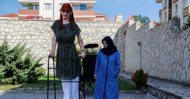 World's tallest woman Rumeysa Gelgi poses with her mother Safiye Gelgi during a news conference outside their home in Safranbolu, Karabük province, Turkey, Oct. 14, 2021. (Reuters Photo)