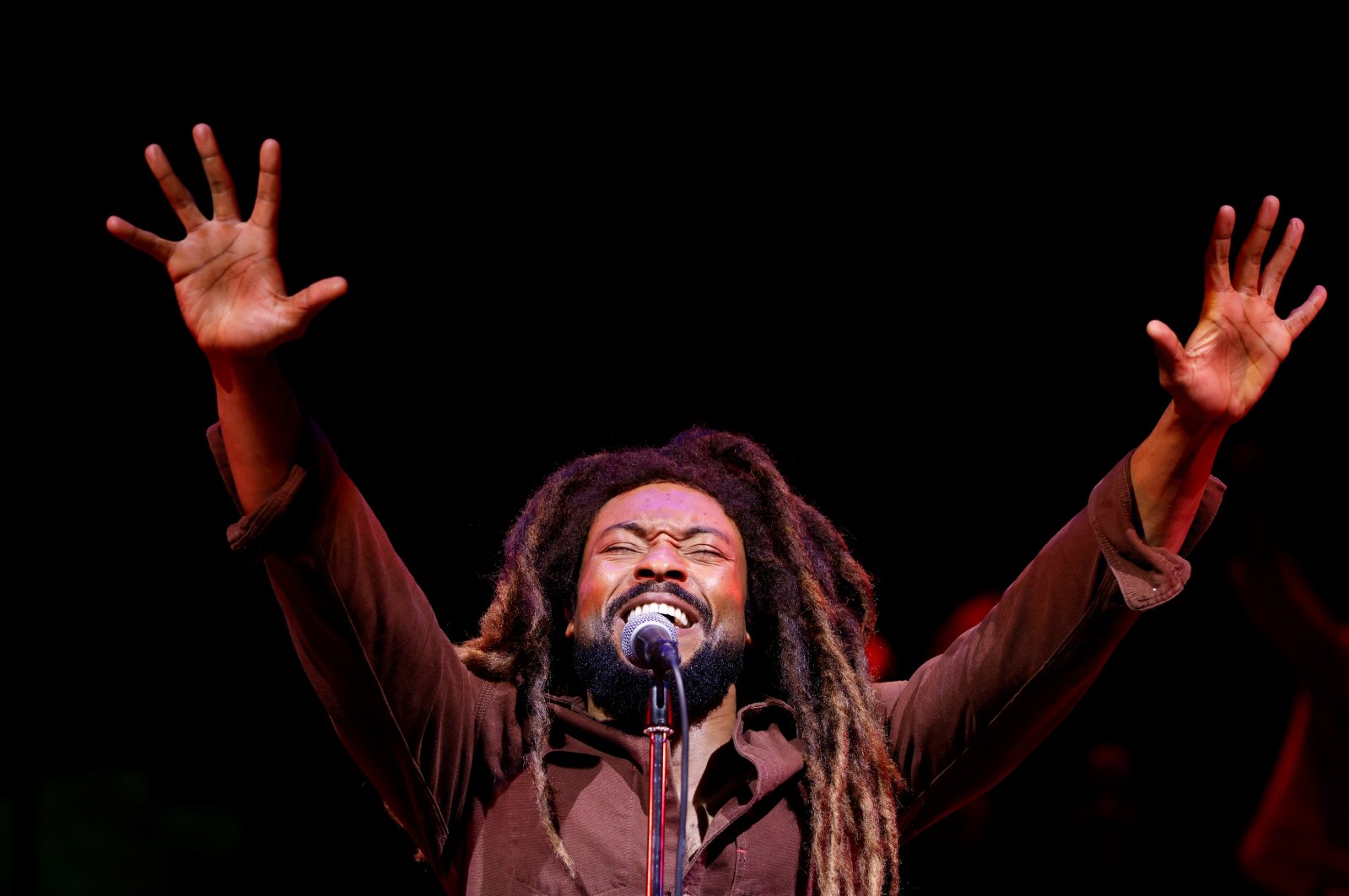 Arinze Kene performs as Bob Marley during a press preview for "Get Up, Stand Up! The Bob Marley Musical," at the Lyric Theatre, in London, Britain, Oct. 14, 2021.  (REUTERS Photo)