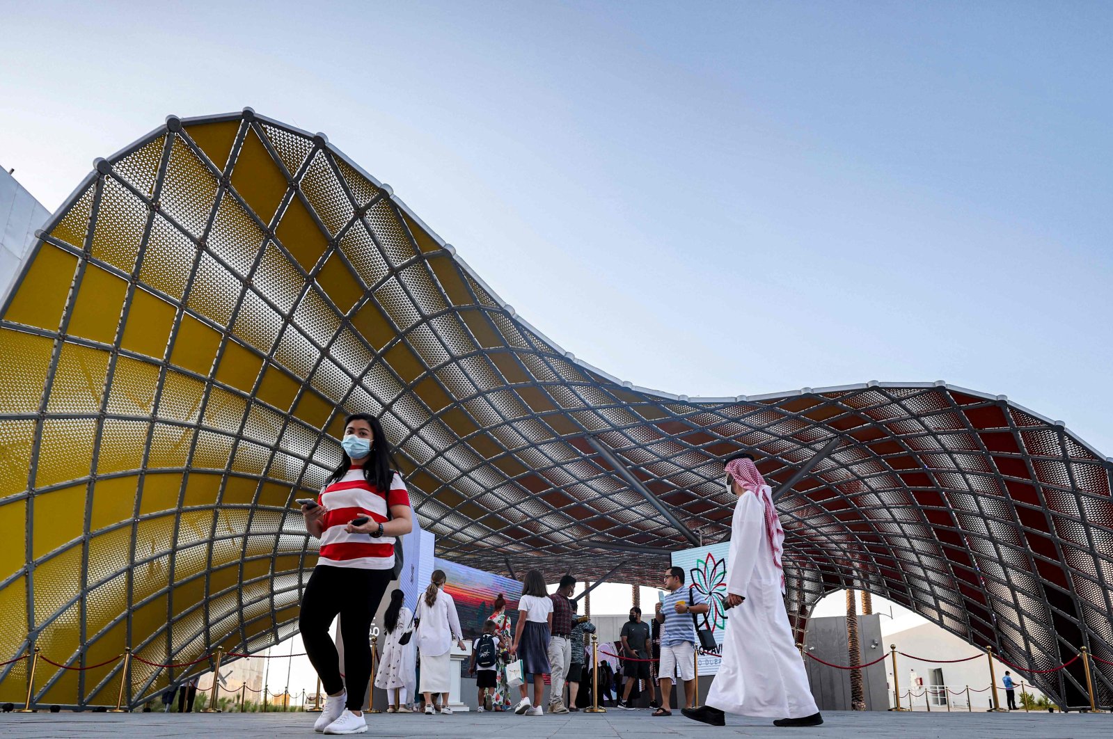 Visitors walk past the exterior of the Iraqi pavilion at the Expo 2020 in the Gulf Emirate of Dubai, on Oct. 13, 2021. (Photo by Karim SAHIB / AFP)