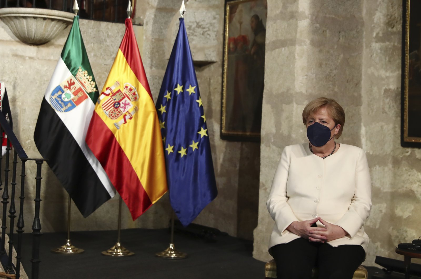 German Chancellor Angela Merkel sits in the Yuste monastery where she received the Charles V European award in Cuacos de Yuste, western Spain, Oct. 14, 2021. (Fernando.Calvo/Spanish government via AP)