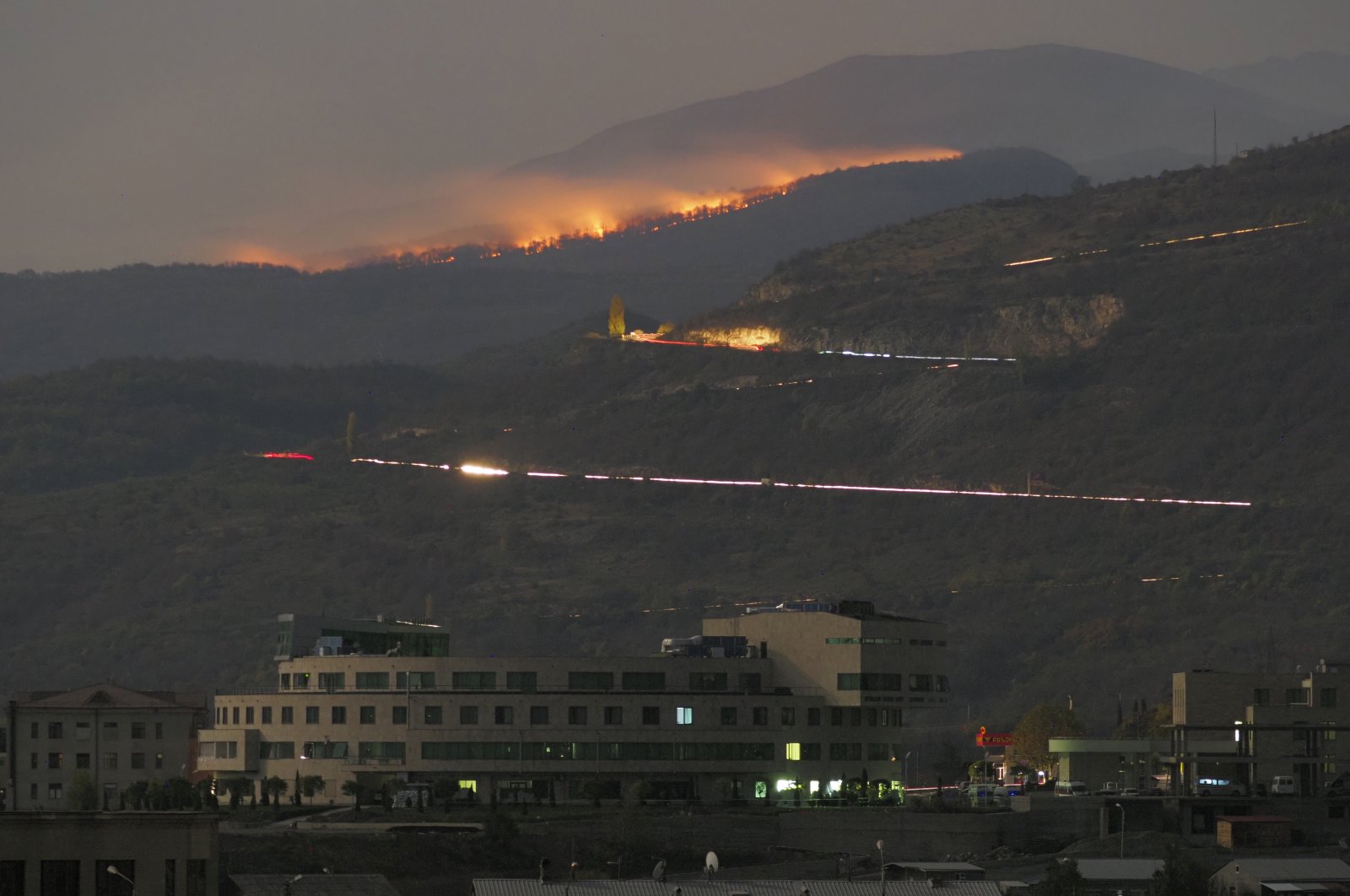 Forest burns in the mountains during a military conflict outside Stepanakert (Khankendi), the Armenian-occupied region of Nagorno-Karabakh, Oct. 30, 2020. (AP Photo)