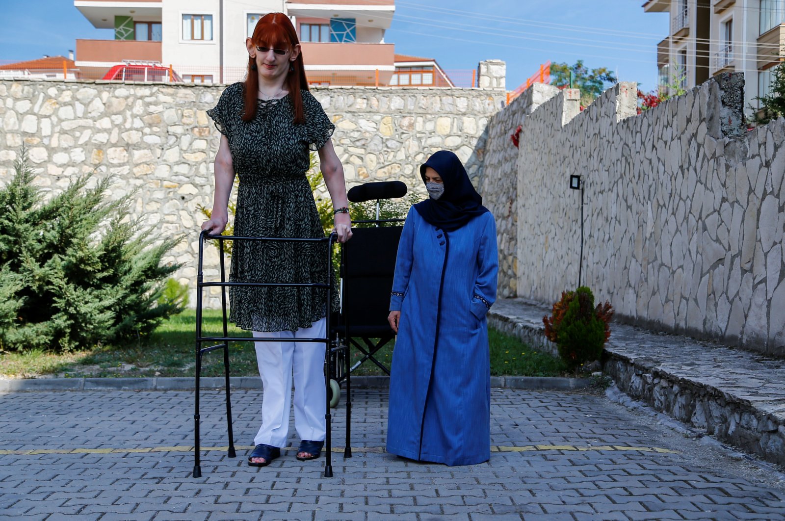 World's tallest woman Rumeysa Gelgi poses with her mother Safiye Gelgi during a news conference outside their home in Safranbolu, Karabük province, Turkey, Oct. 14, 2021. (Reuters Photo)