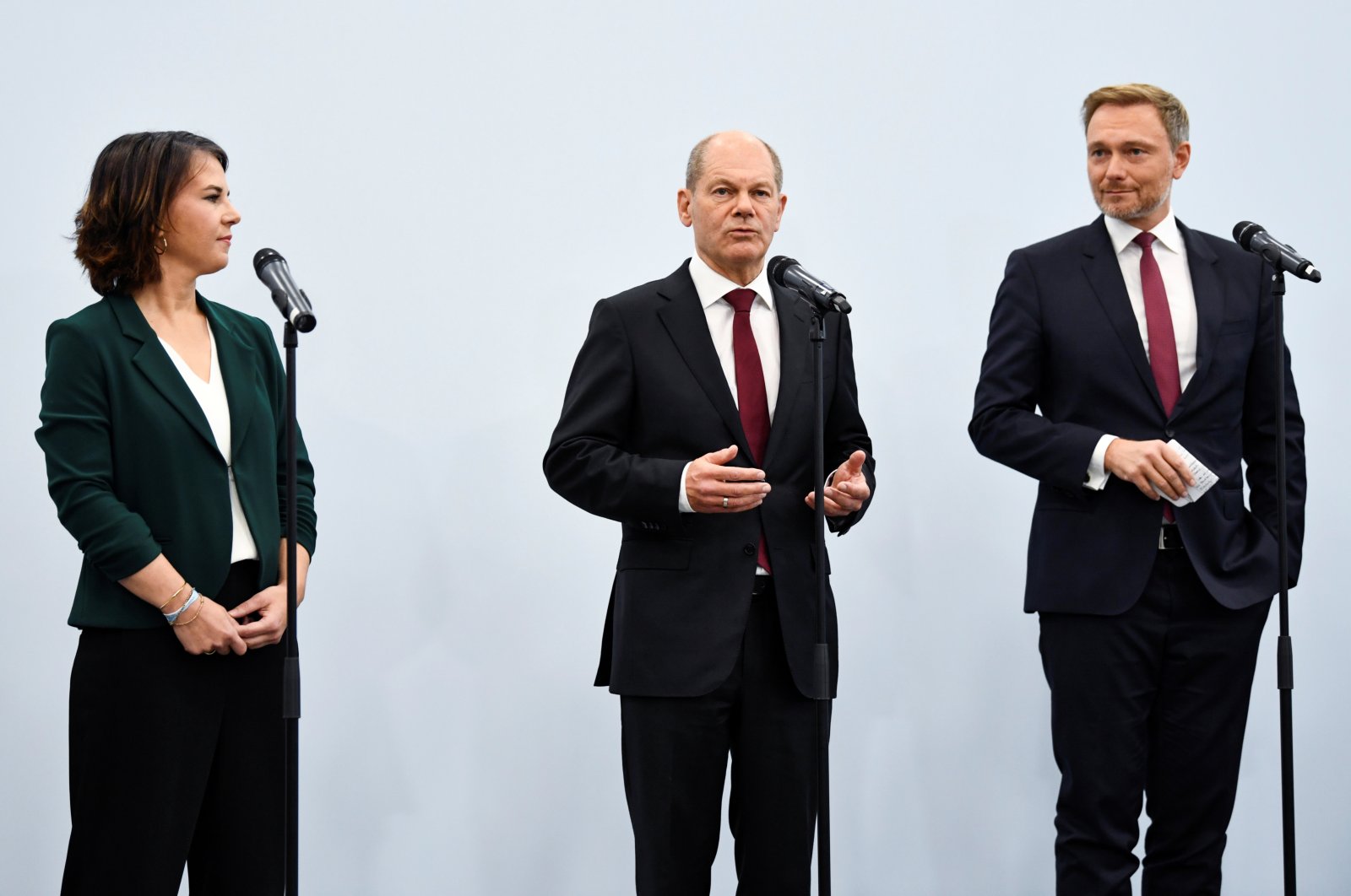 Germany's Greens party co-leader Annalena Baerbock and Free Democratic Party (FDP) leader Christian Lindner listen to Social Democratic Party (SPD) top candidate for chancellor Olaf Scholz as he gives a statement following a meeting for exploratory talks for a possible new government coalition in Berlin, Germany, Oct. 15, 2021. (Reuters Photo)