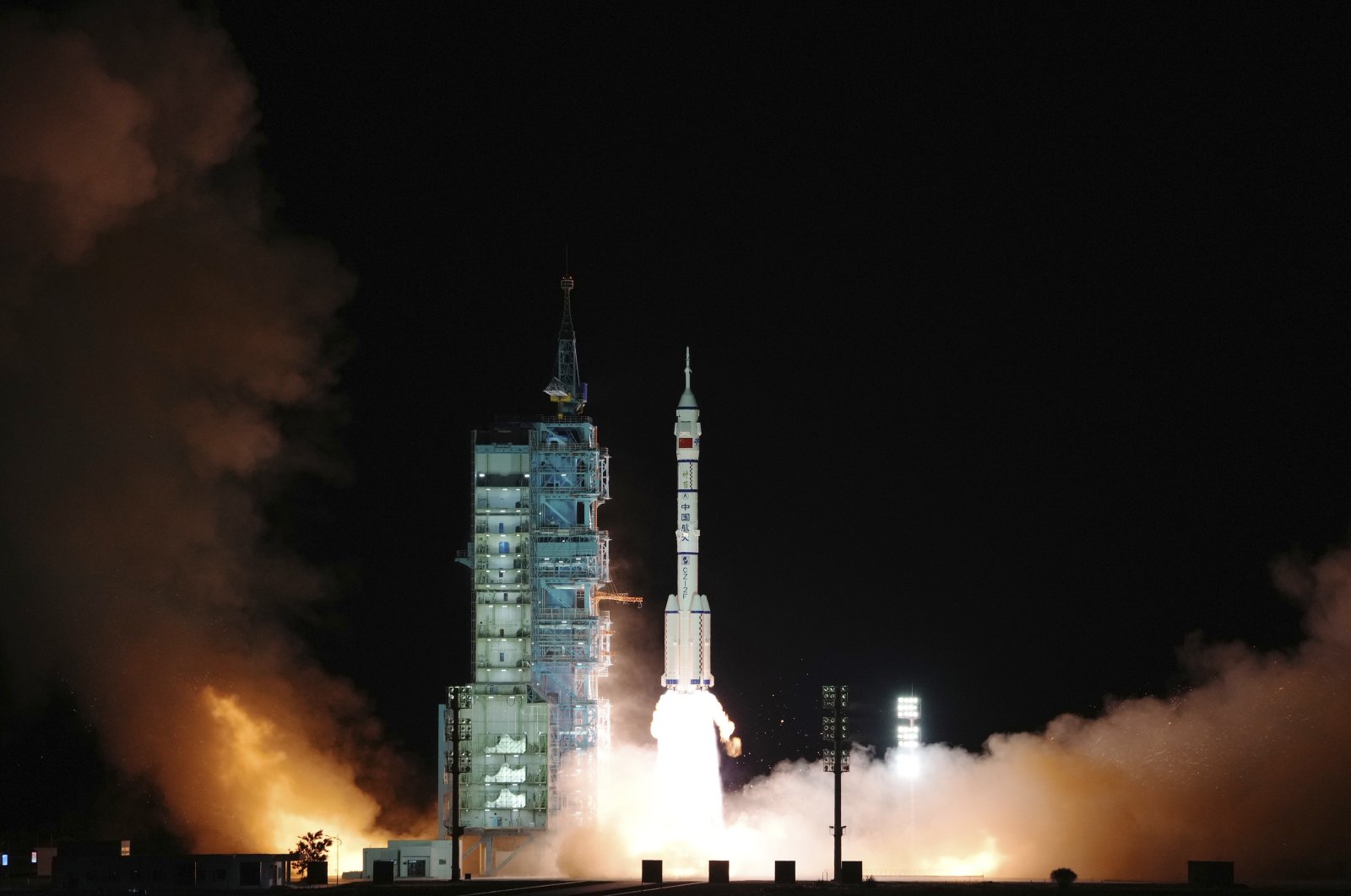 The crewed spaceship Shenzhou-13, atop a Long March-2F carrier rocket, is launched from the Jiuquan Satellite Launch Center in northwest China's Gobi Desert, Oct. 16, 2021. (Xinhua via AP)